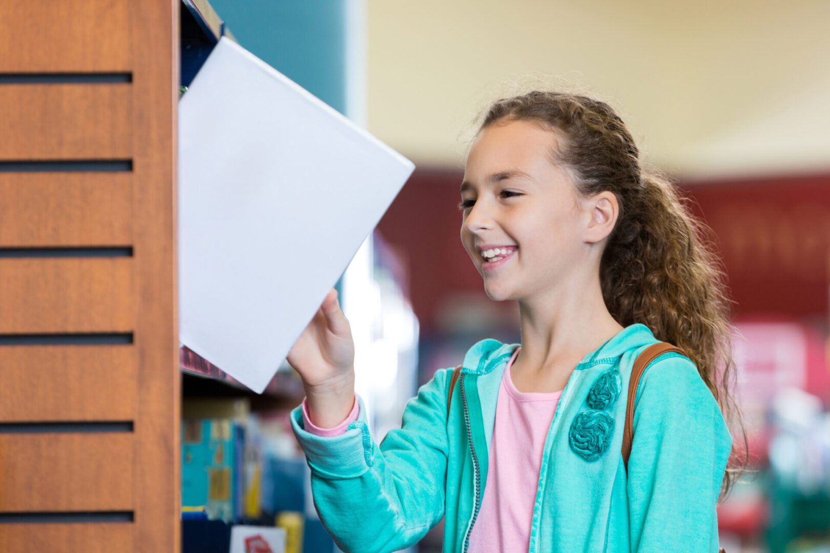 Child selecting a book to read
